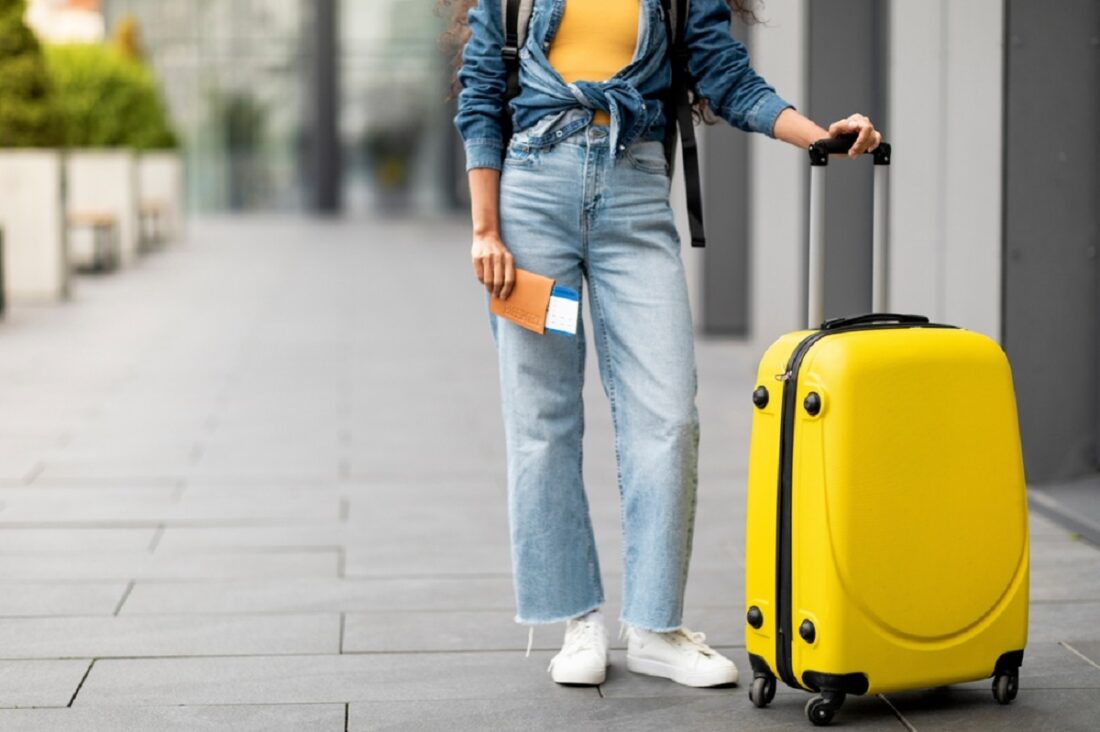 Cropped,Of,Woman,In,Casual,Outfit,Tourist,With,Yellow,Suitcase
