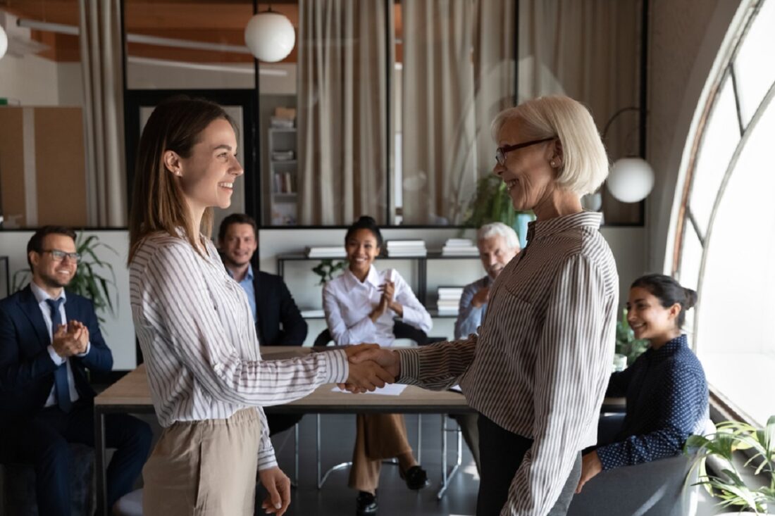 Happy,Mature,Female,Business,Leader,Shaking,Hand,Of,New,Employee,