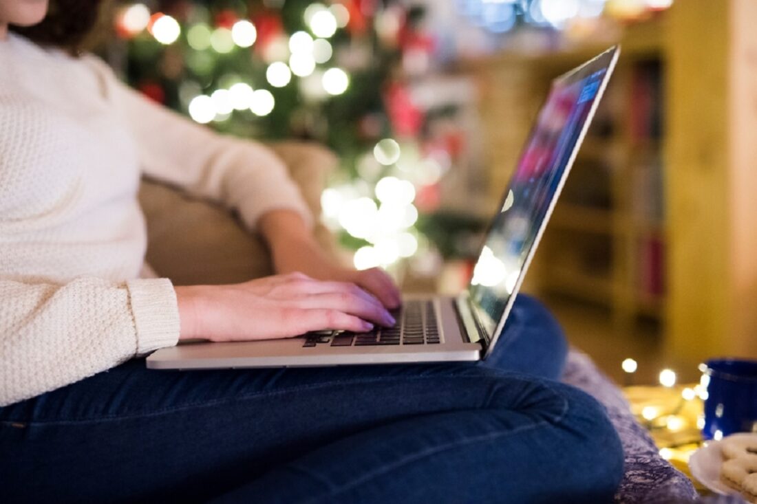 Young,Woman,Is,Shopping,For,Christmas,Gifts,Online,Using,Her