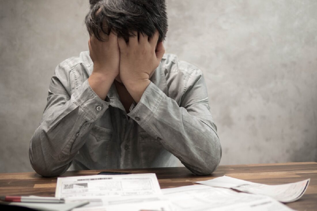 Man,Having,Financial,Problems,With,Invoices,And,Credit,Cards,,Money
