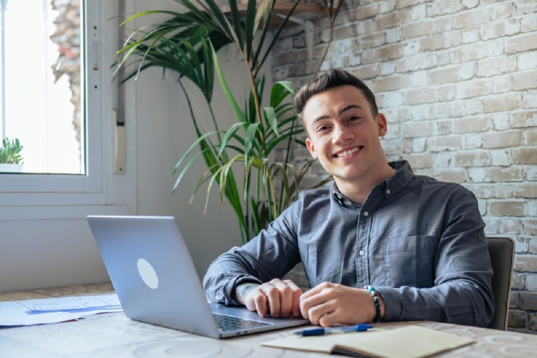 Good-looking,Millennial,Office,Employee,In,Glasses,Sitting,At,Desk,In