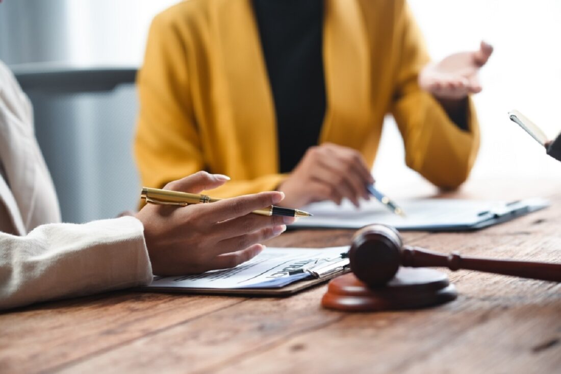 A,Professional,Consultation,Scene,Featuring,Hands,Discussing,Documents,And,A