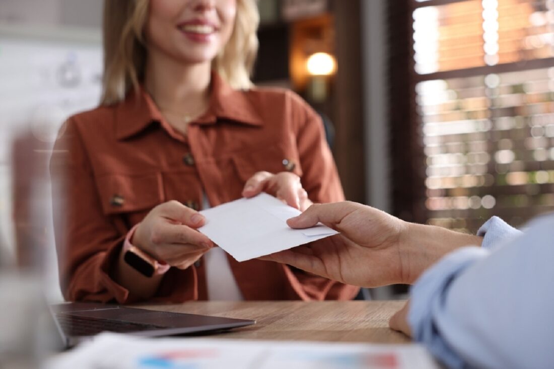 Money,Bonus.,Employee,Receiving,Envelope,From,Boss,In,Office,,Closeup