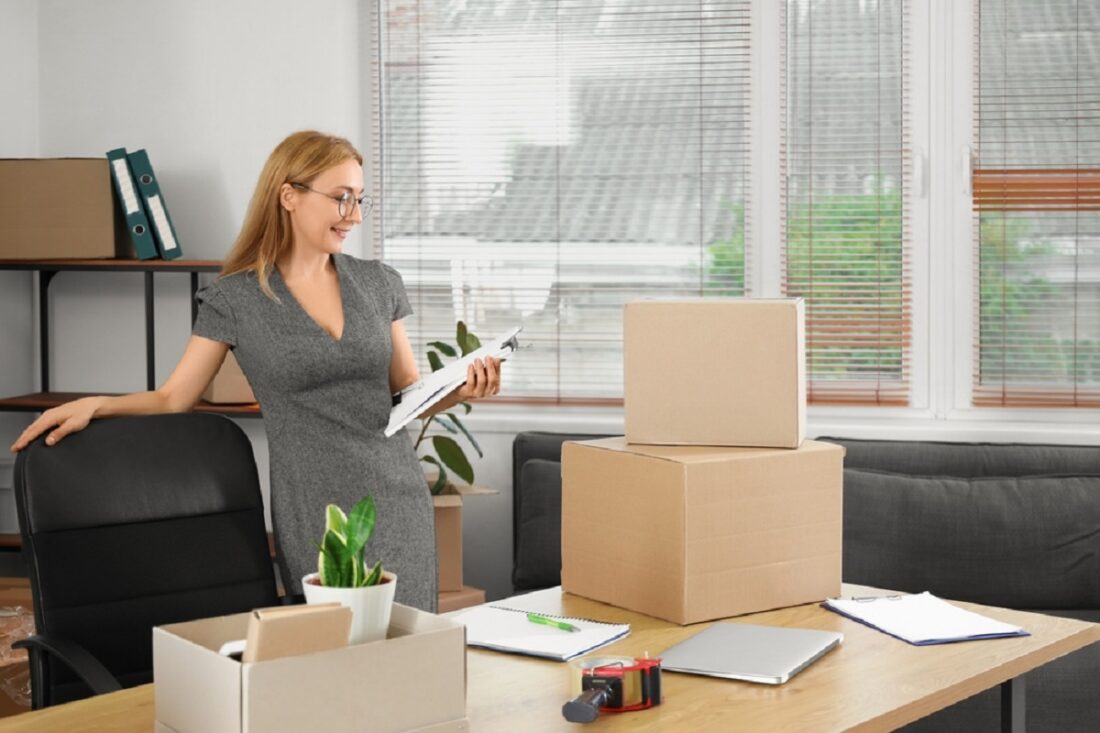 Mature,Businesswoman,With,Papers,In,Office,On,Moving,Day