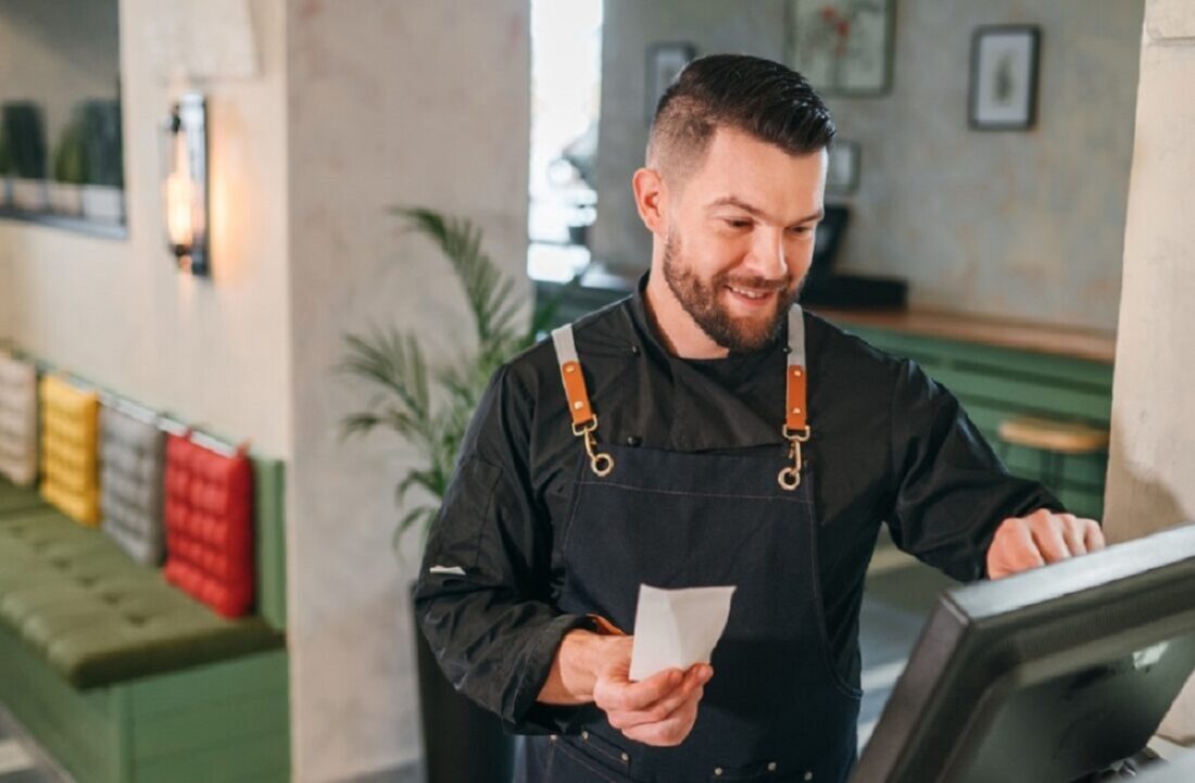 Stylish,Bearded,Smiling,Waiter,Dressed,Black,Uniform,Processing,Customer,Orders