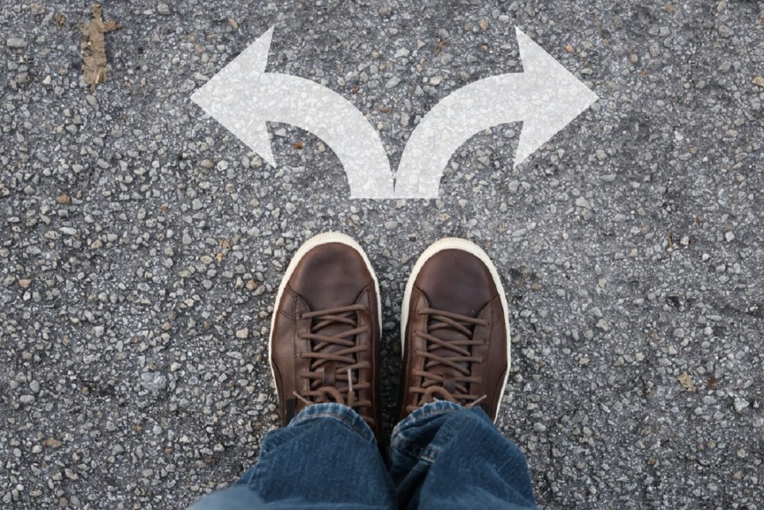 Top,View,Of,A,Person,Standing,On,A,Asphalt,Surface