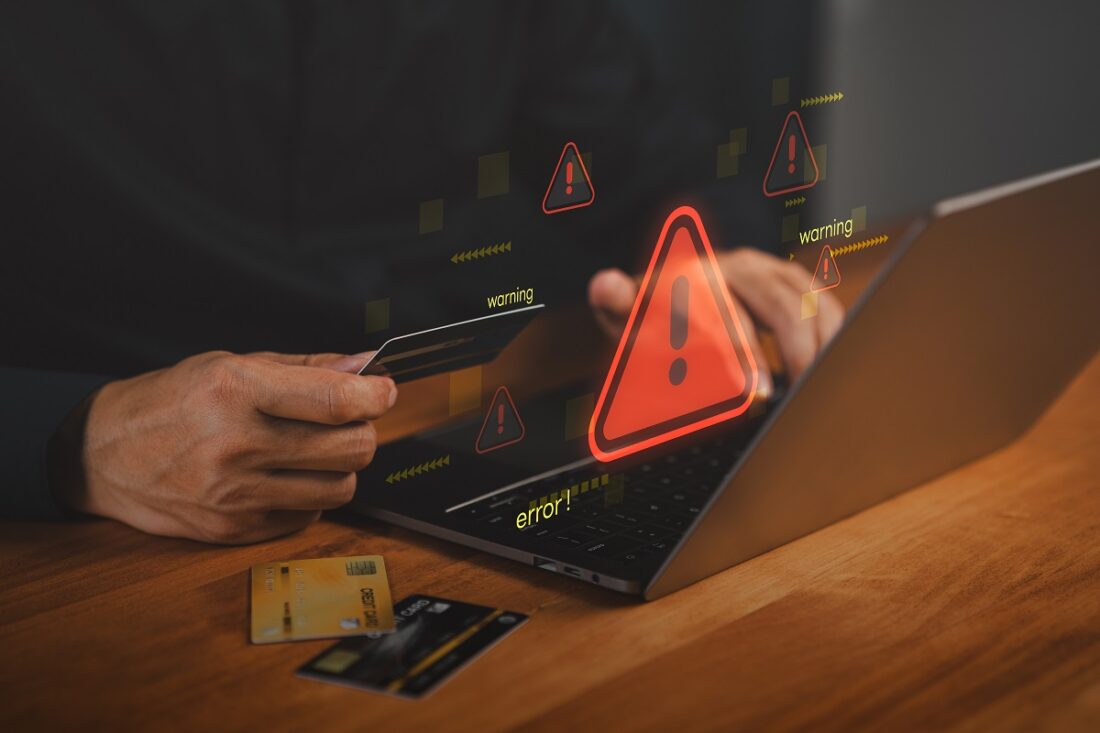 Hacker,Warning,Alert,During,Online,Credit,Card,Payment,On,Laptop.