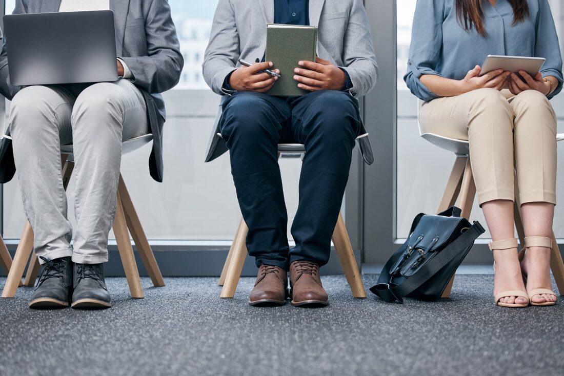 Recruitment,,Row,And,Business,People,Waiting,In,Office,With,Tablet,