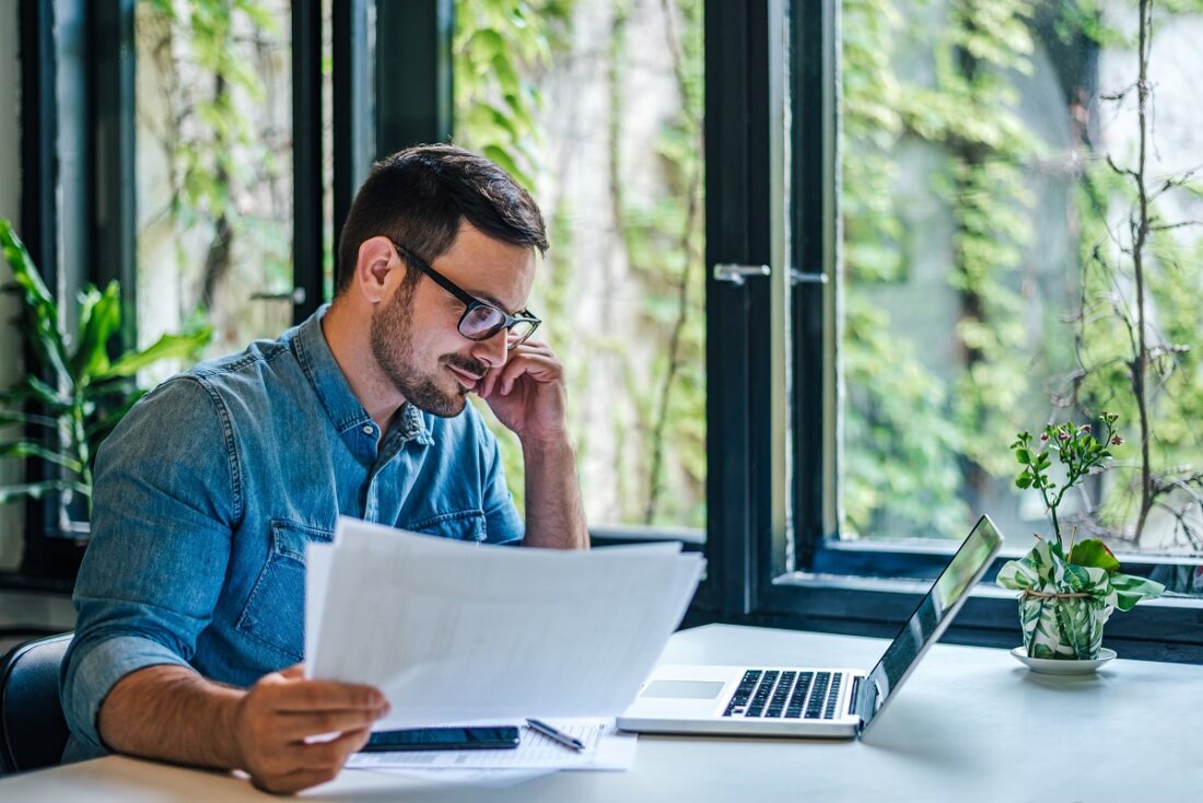 Male,Entrepreneur,Or,Businessman,Expert,Reading,Documents,At,Office.,Manager